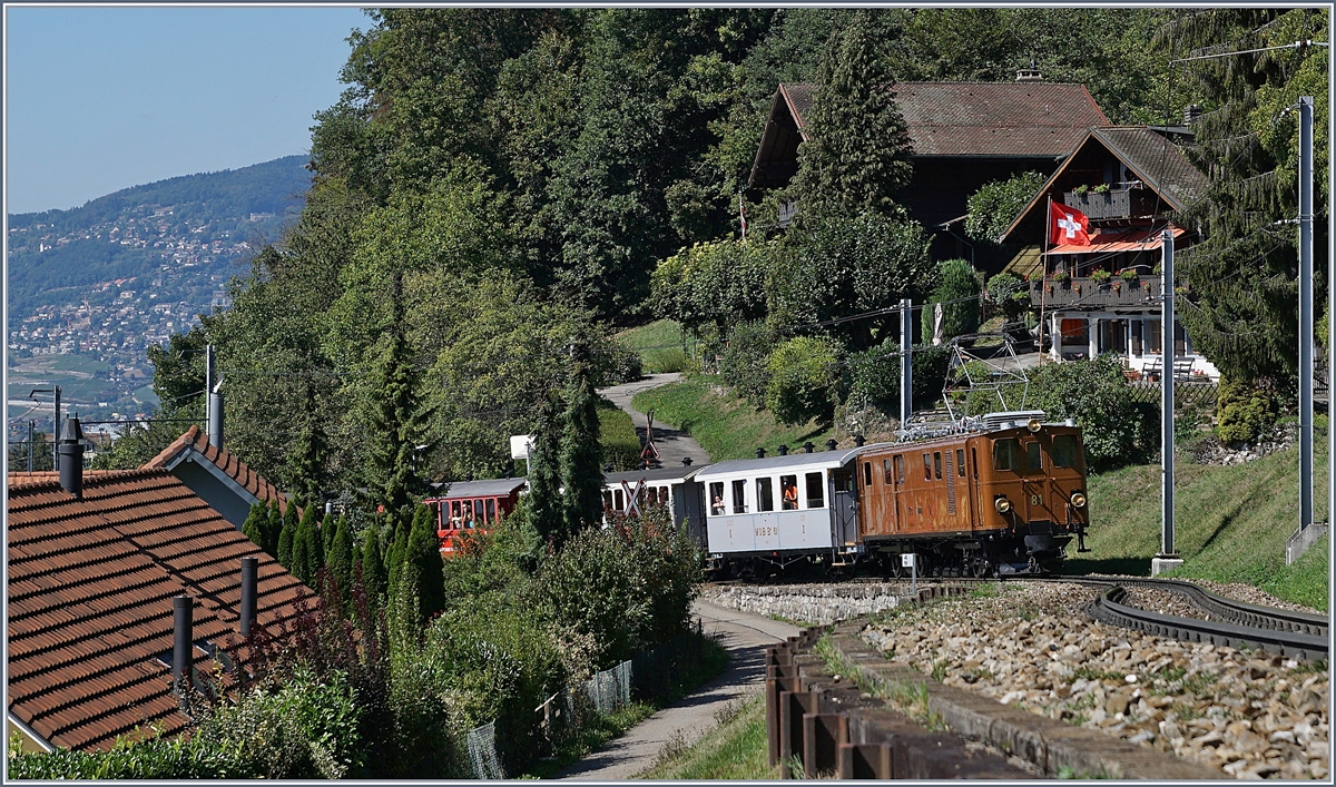 50 Jahre Blonay Chamby - MEGA BERNINA FESTIVAL: Die Bernina Bahn Ge 4/4 81 erklimmt mit dem  Riviera-Belle-Epoque Zug von Montreux nach Chaulin die Steigung zwischen Chernex und Sonzier. 

n 8. Sept. 2018