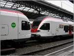 lausanne/730638/ein-rer-rabe-523-und-ein Ein RER RABe 523 und ein TILO 524 bilden vereint einen S-Bahn Zug in Lausanne. 

15. Okt. 2013