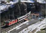 Die SBB RE 4/4 II 11193 verlässt mit ihrem IR 2422 von Locarno nach Zürich den 1084 Meter langen Wattinger Kehrtunnel. 
17. März 2016