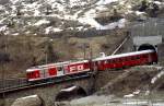 Im Mai 1980 trifft ein Deh 4/4 der Furka-Oberalp-Bahn (FO) mit einem Personenzug aus Andermatt in Gschenen ein