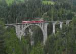 915-filisur-8211-davos-platz/372046/auf-der-fahrt-von-davos-platz Auf der Fahrt von Davos Platz nach Filisur überfährt am 23.08.2014 ein Allegra die höchste und größte Mauerwerksbrücke der Rhätischen Bahn, den Wiesener Viadukt.