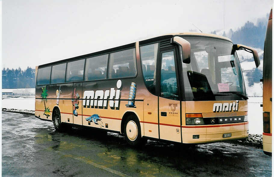 (039'102) - Marti, Kallnach - Nr. 12/BE 102'201 - Setra am 19. Februar 2000 in Frutigen, Flugplatz