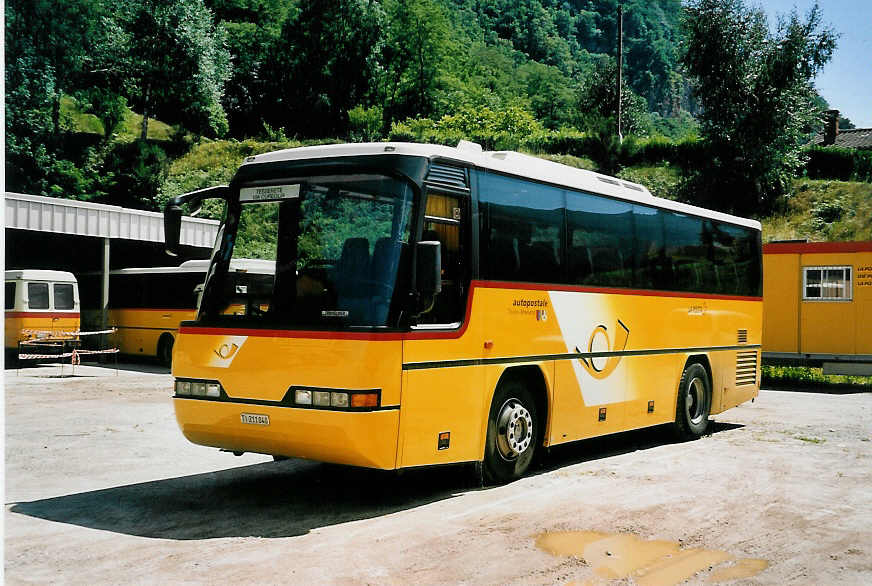 (054'619) - Autopostale, Taverne - TI 211'040 - Neoplan (ex P 23'703) am 22. Juli 2002 in Taverne, Garage