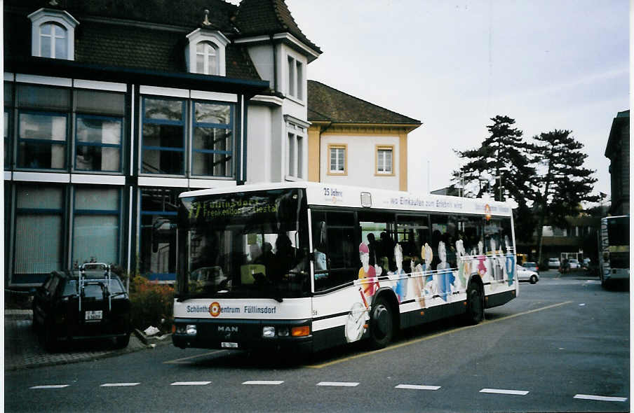 (064'316) - AAGL Liestal - Nr. 56/BL 7861 - MAN/MAN-Lauber am 15. November 2003 beim Bahnhof Liestal