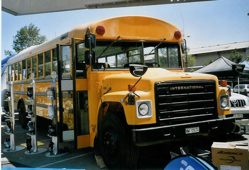 (068'116) - Raimann, Zug - NW 12'474 - International (ex US-Schulbus) am 29. Mai 2004 in Biel, Kongresshaus