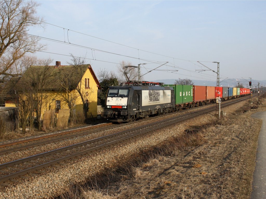 Die ES 64 F4-150 am 05.03.2011 mit einem Containerzug unterwegs bei Plling.
