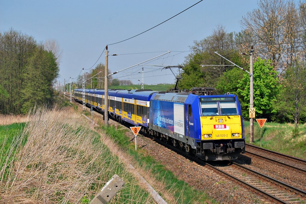 Mit dem Connex nach Leipzig saust die 146 520 am 26.04.2011 durch das sdwestlich von Rostock gelegene Sildemow.