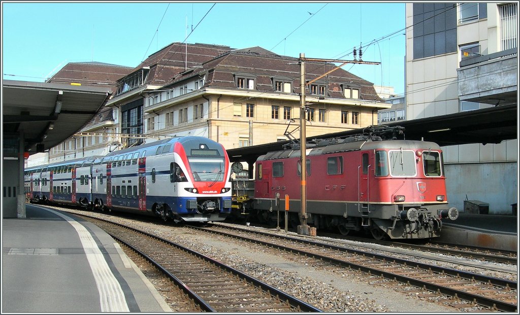 Re 4/4 II und 511 001  Berlin  in Lausanne am 14. April 2011