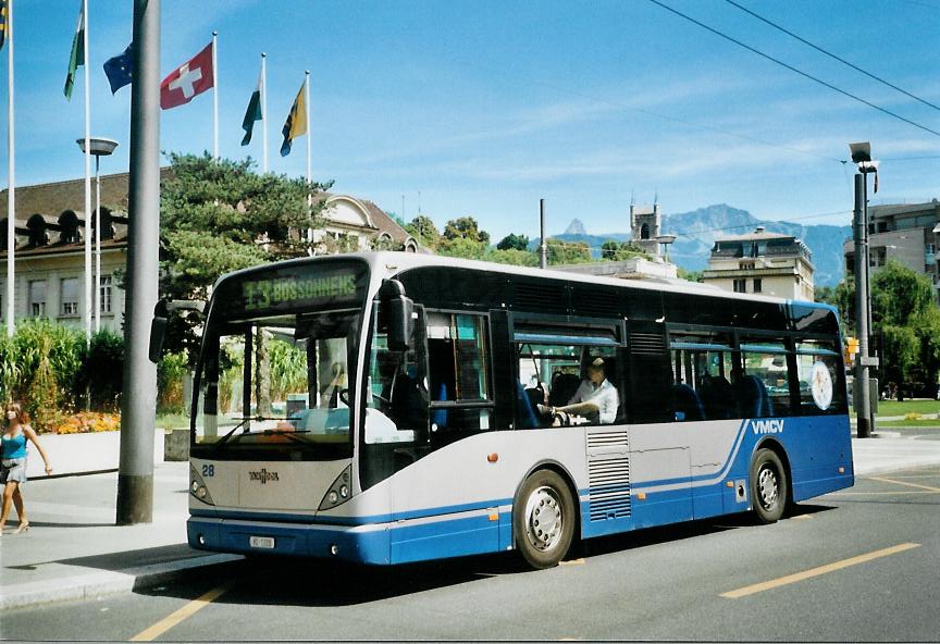 (110'119) - VMCV Clarens - Nr. 28/VD 1320 - Van Hool am 10. August 2008 beim Bahnhof Vevey