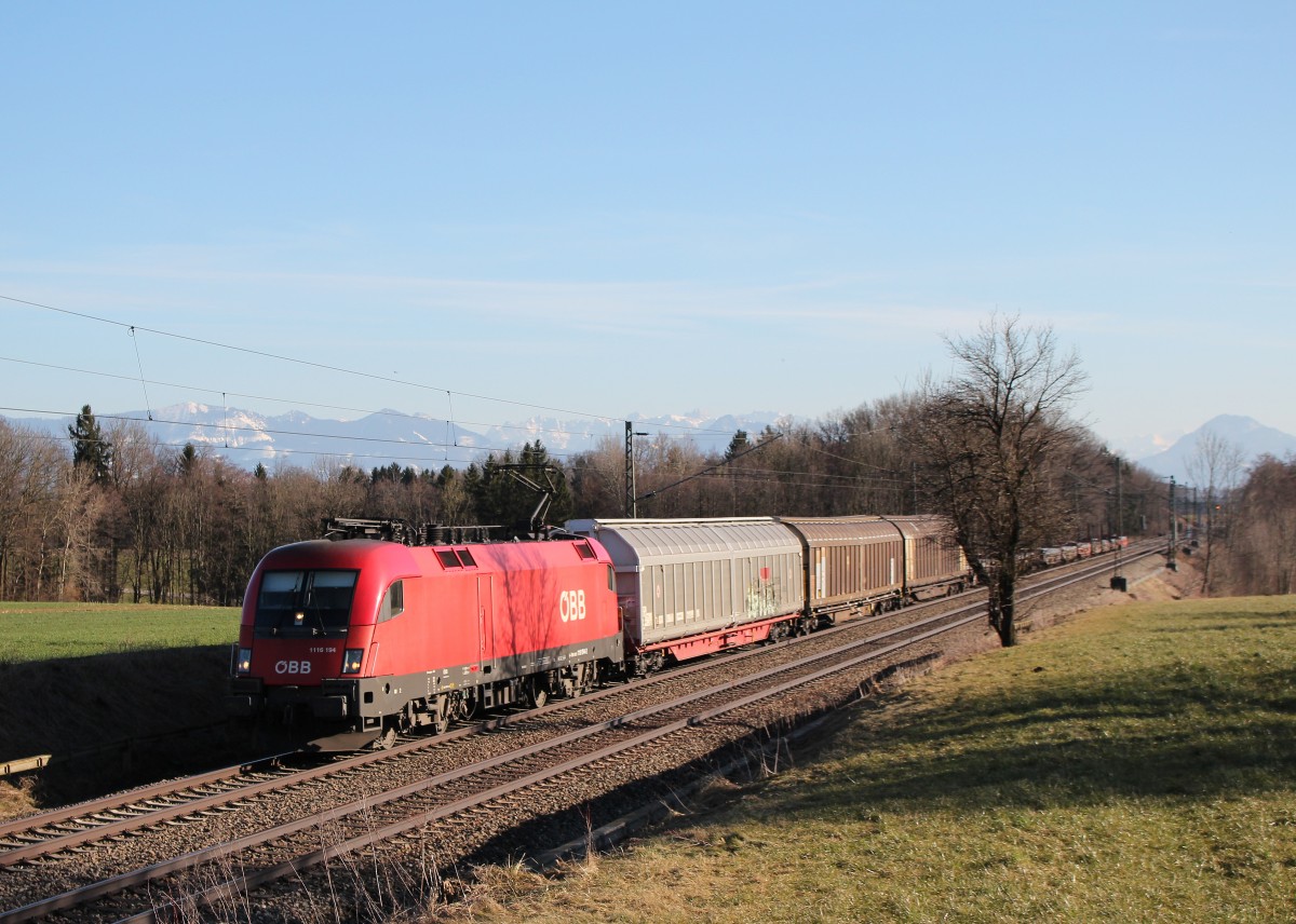 1116 194-2 mit einem gemischten Gterzug am 7. Mrz 2015 bei Hilperting.