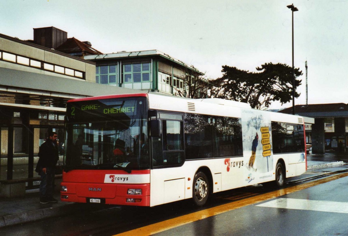 (123'230) - CarPostal Ouest - VD 1160 - MAN am 23. Dezember 2009 beim Bahnhof Yverdon