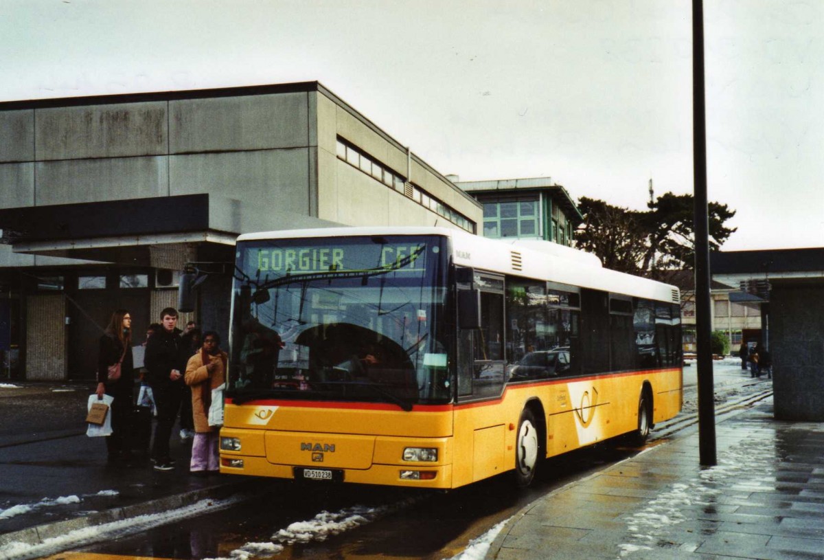 (123'232) - CarPostal Ouest - VD 510'238 - MAN (ex P 25'144) am 23. Dezember 2009 beim Bahnhof Yverdon