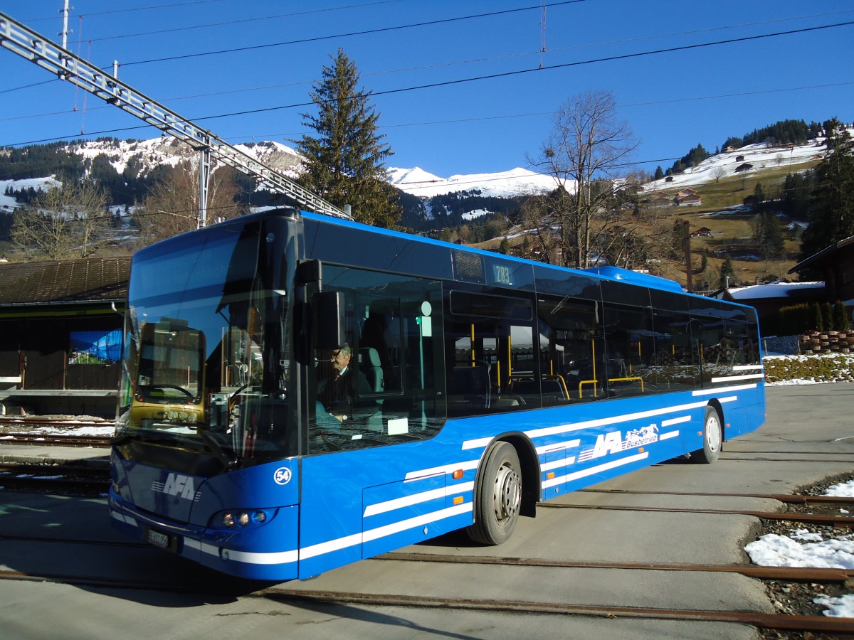 (137'160) - AFA Adelboden - Nr. 54/BE 611'056 - Neoplan (ex VBZ Zrich Nr. 243) am 11. Dezember 2011 beim Bahnhof Lenk