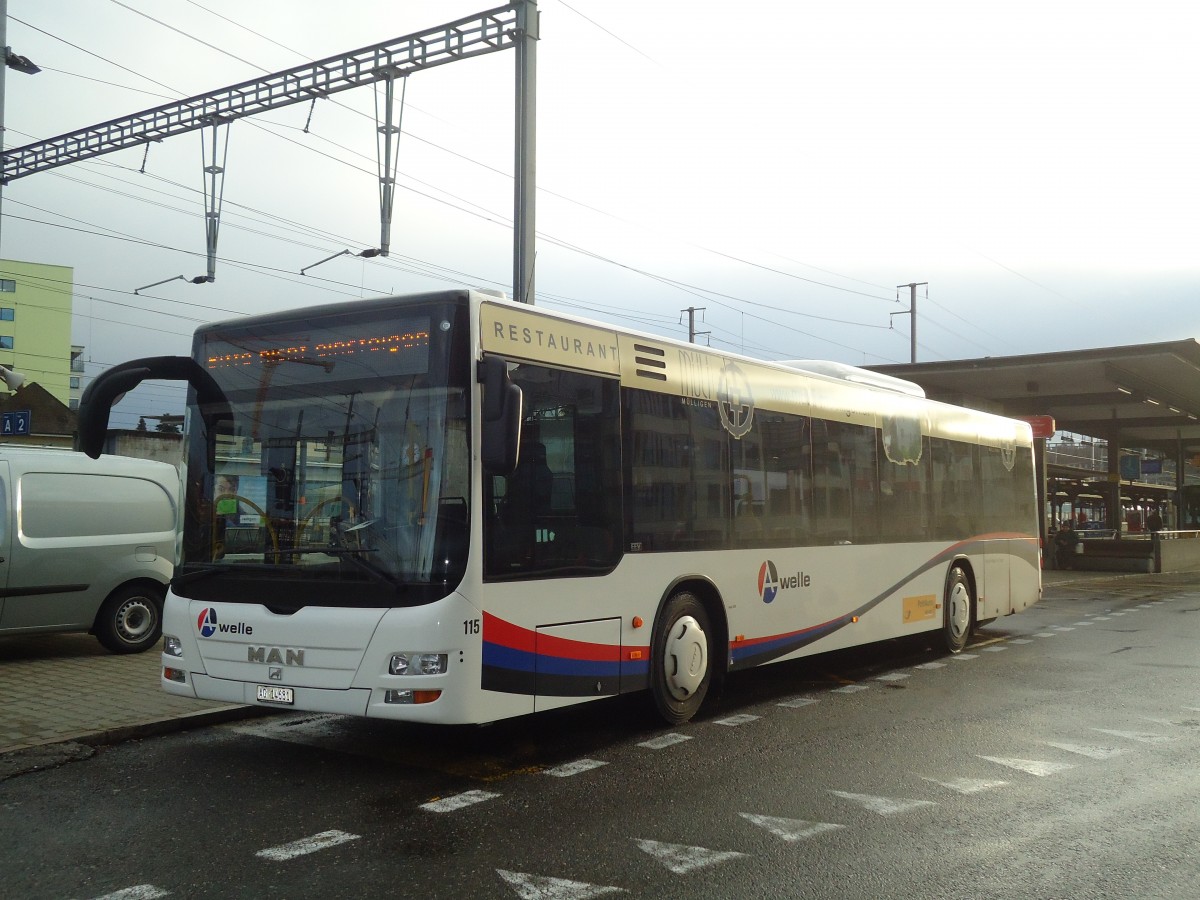 (137'215) - Voegtlin-Meyer, Brugg - Nr. 115/AG 14'681 - MAN am 14. Dezember 2011 beim Bahnhof Burgg