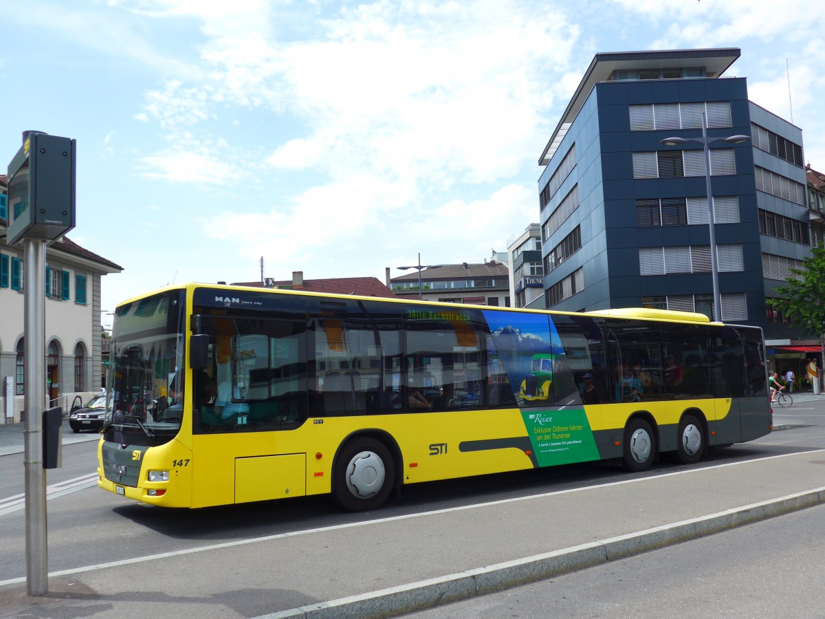 (151'781) - STI Thun - Nr. 147/BE 801'147 - MAN am 22. Juni 2014 beim Bahnhof Thun