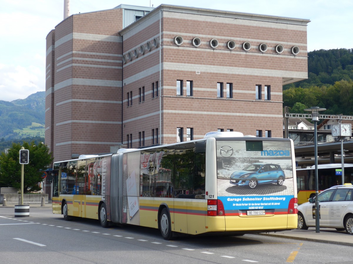 (154'448) - STI Thun - Nr. 121/BE 700'121 - MAN am 24. August 2014 beim Bahnhof Spiez