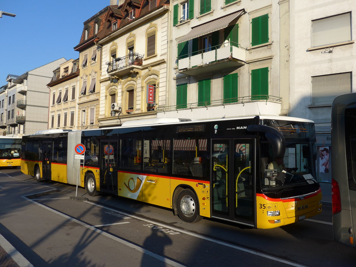 (174'335) - CarPostal Ouest - Nr. 35/JU 52'075 - MAN am 28. August 2016 beim Bahnhof Payerne