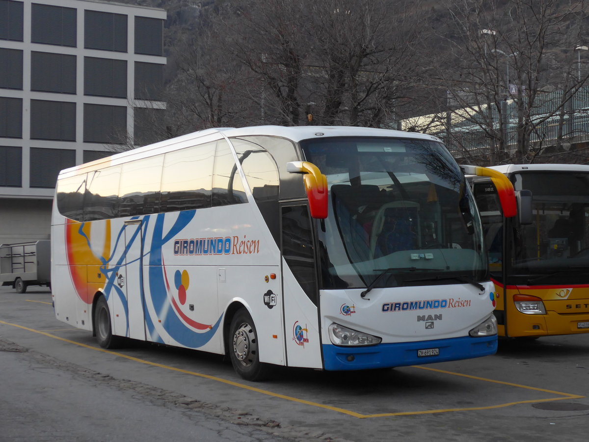 (176'854) - Giromundo, Zrich - ZH 691'924 - MAN/Atomic am 4. Dezember 2016 beim Bahnhof Brig