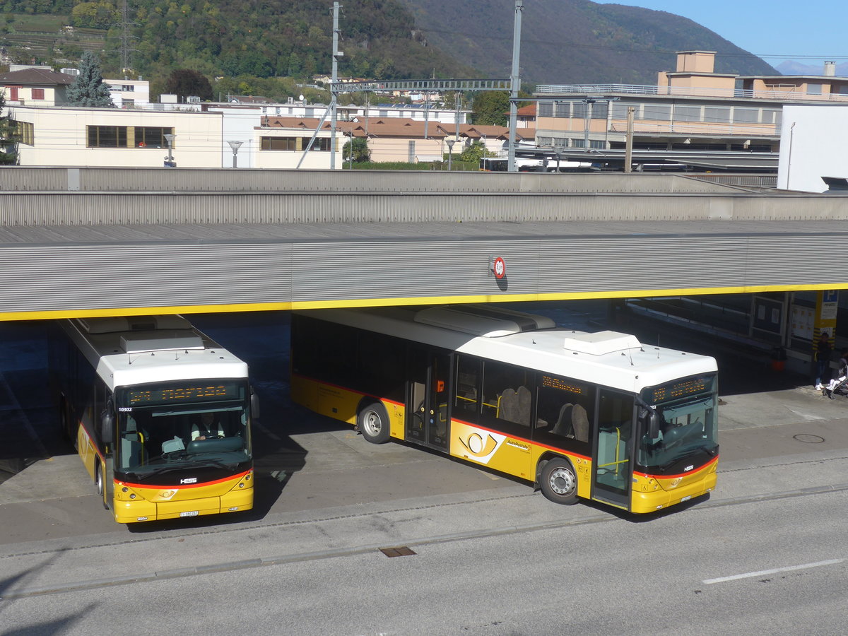 (210'541) - Autopostale, Mendrisio - TI 180'267 + TI 180'297 - Scania/Hess am 26. Oktober 2019 beim Bahnhof Mendrisio