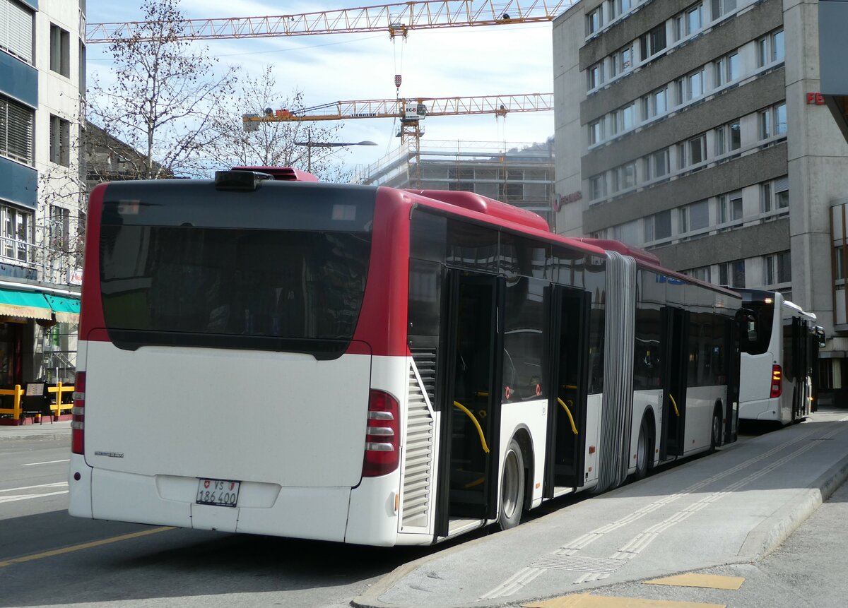 (247'237) - PostAuto Wallis - Nr. 65/VS 186'400/PID 5315 - Mercedes (ex Lathion, Sion Nr. 65) am 16. Mrz 2023 beim Bahnhof Sion