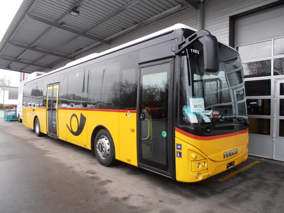 (257'509) - CarPostal Ouest - PID 11'972 - Iveco am 9. Dezember 2023 in Kerzers, Interbus