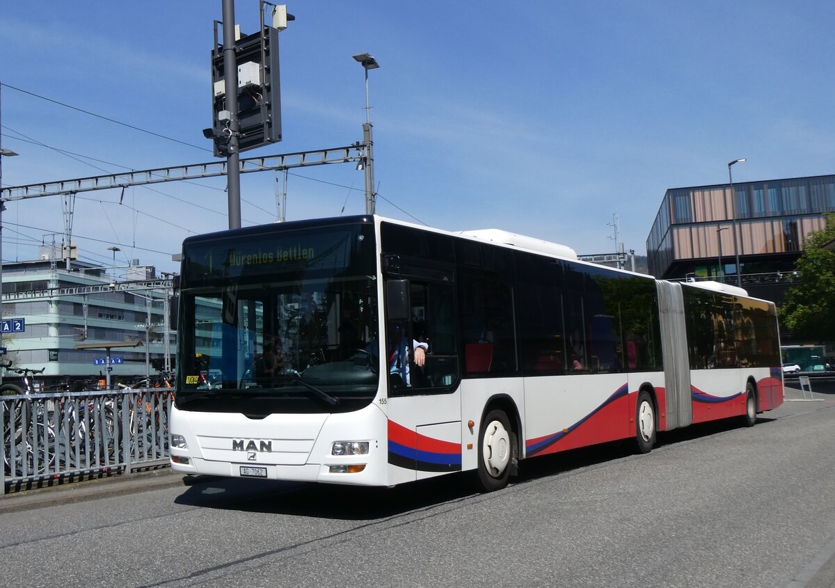 (261'176) - RVBW Wettingen - Nr. 155/AG 7062 - MAN am 12. April 2024 beim Bahnhof Baden