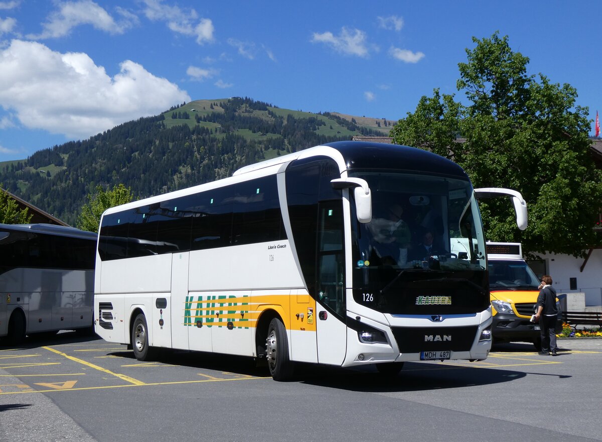 (275'615) - Aus Litauen: Jouzpaviciaus, Kaunas - Nr. 126/MDH 487 - MAN am 16. Mai 2025 beim Bahnhof Gstaad