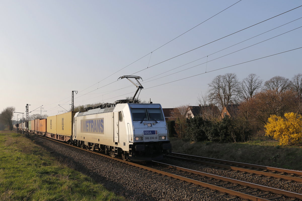 386 036 mit einem Containerzug aus Bremerhaven kommend am 29. Mrz 2019 bei Loxstedt.