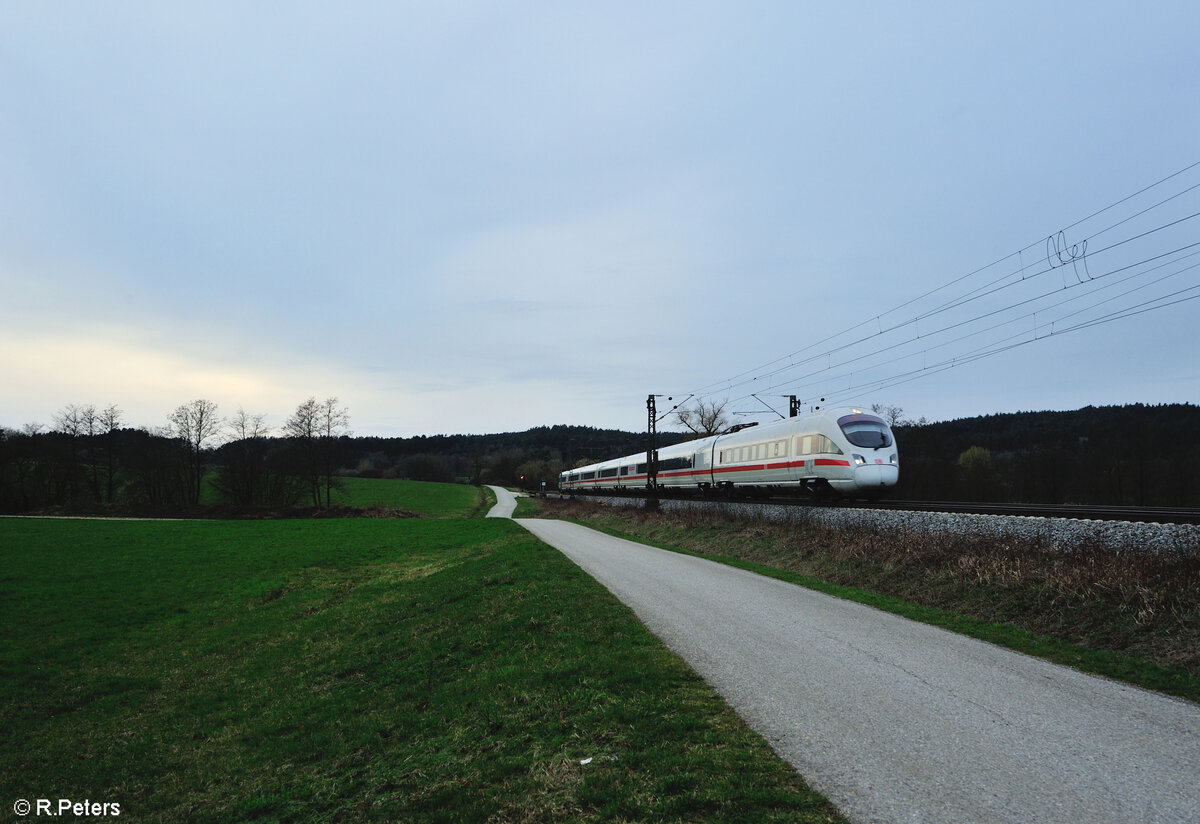 411 063-1  Ostseebad Binz  als ICE 229 Koblenz - Wien bei Pölling. 17.03.24