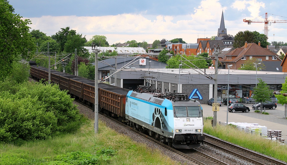 CAPTRAIN 185 549 mit Kohlenzug vor der Kulisse von Hasbergen 08.06.2022