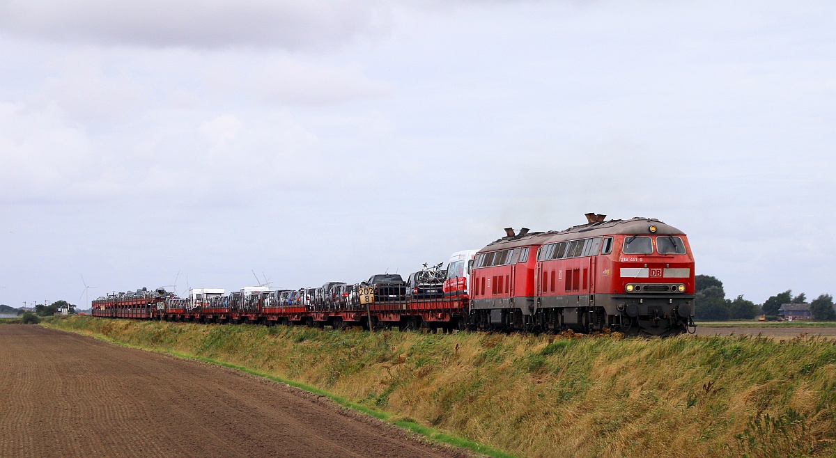 DB 218 491-9 REV/HB X/11.11.16 und 380-4 REV/HB X/17.03.16 mit SyltShuttle gen Niebüll. Bü Triangel 15.08.21