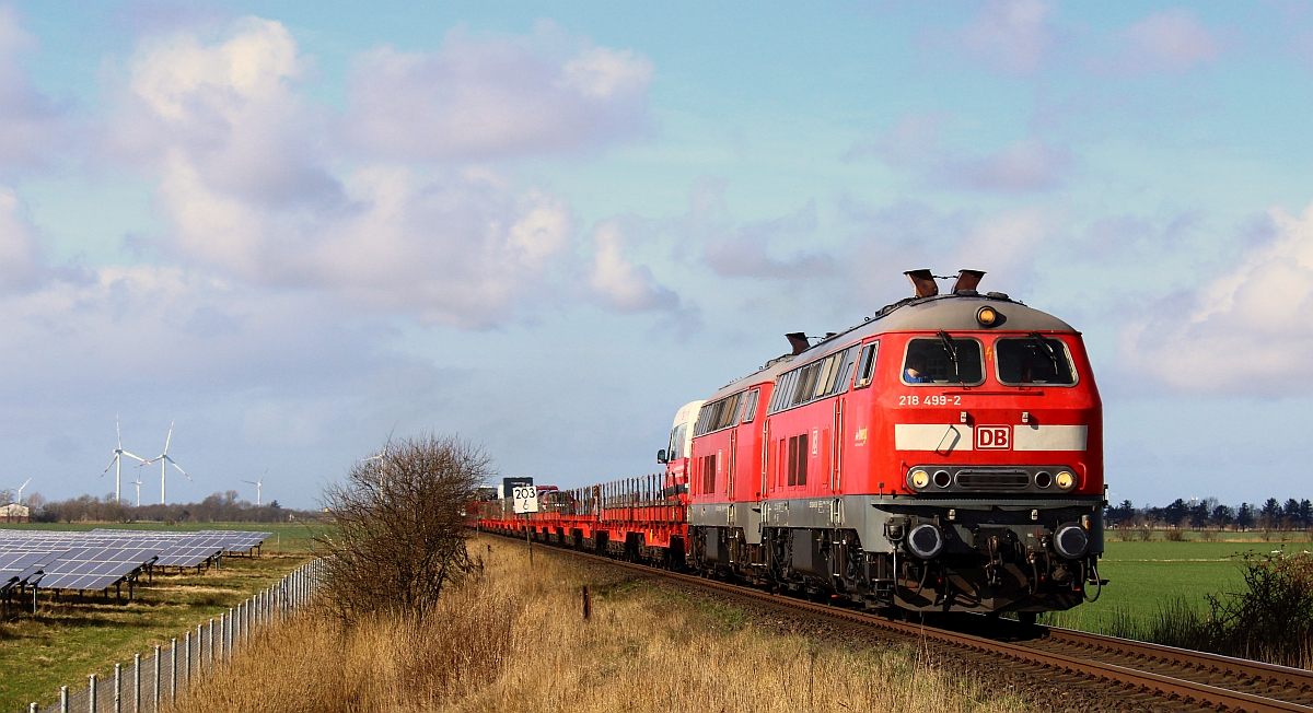 DB 218 499-2, REV/BCS X/09.12.19 und 218 397-8 mit SyltShuttle nach Niebüll. Bü Südergotteskoog 26.02.2022