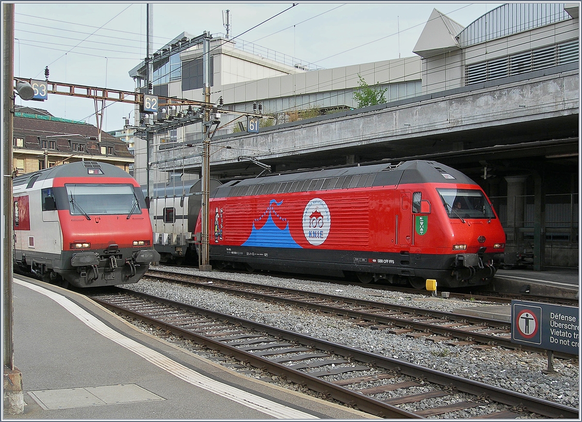 Die SBB Re 460 058-1  100 Jahre Zirkus Knie  wartet mit ihrem IC1 713 von Genève Aéroport nach St. Gallen in Lausanne auf die Abfahrt.

21. April 2019
