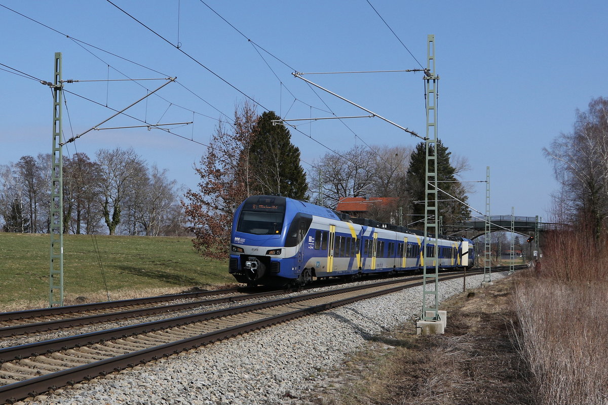 ET 313 aus Salzburg kommend am 7. Mrz 021 bei bersee am Chiemsee.