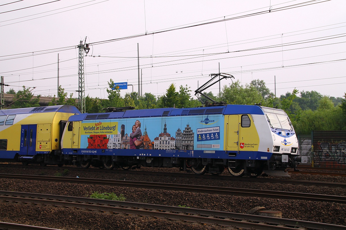 Metronom ME 146-02 oder 146 502-0 beklebt mit Werbung für die Stadt Lüneburg hier bei der Einfahrt in HH-Harburg. 28.06.2014