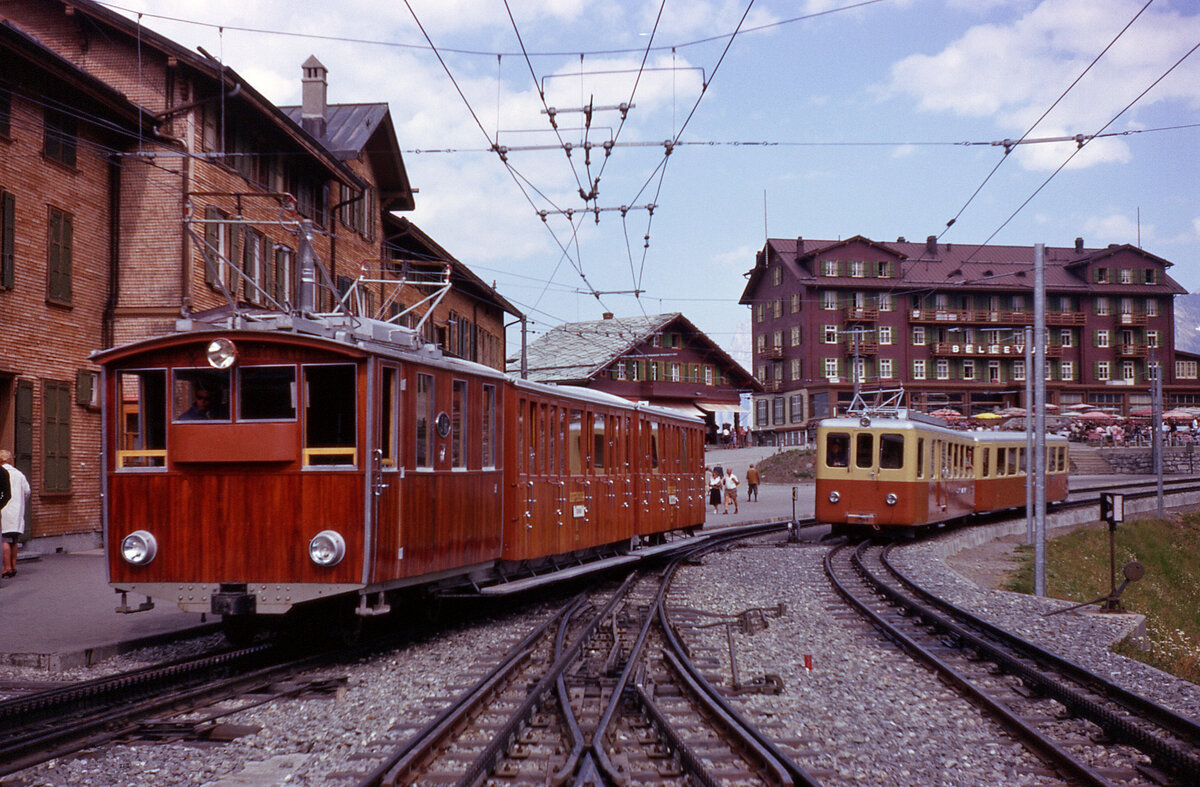 Two different Jungfraubahn (JB) trains at Kleine Scheidegg on 3rd Septeber 1962.