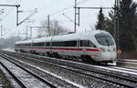 ICE-TD DSB/DB 605 003/103/203/503 als ICE 381 auf dem Weg nach Berlin hier bei der Ausfahrt in Schleswig bei leichtem Schneefall.