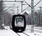 Gepuderte Gumminase...DSB MFA/FF/MFB 50/54/5290 als EC 386 nach Aarhus hat hier während einer kleinen Schneepause Einfahrt in Schleswig.