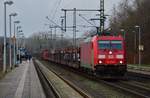 DBS/RSC 185 331-3 mit langem Gz rollt hier langsam durch Schleswig, Grund Überholung eines IC's.