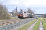 TXL 193 878   Wir brennen fr was wir tun  mit einem Autozug am Haken gen Karlstadt fahrend In Thngersheim. 17.2.2024 
 