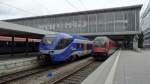 Links ein Meridian nach Rosenheim und rechts ein Railjet nach Budapest, stehen in München Hbf. 
Aufgenommen im September 2014.