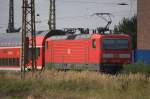 143 973  als Zuglok einens  Zuges  der Linie S1 bei der Ausfahrt  Coswig.