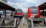 Eine n-Wagen Garnitur und ein Triebzug der Baureihe 612 im Endbahnhhof München Hbf.