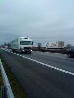 SZM Mercedes-Benz Actros mit Khlkofferauflieger der Firma Real gesehen auf der A 61, Hhe Raststtte Dannstadt, am 16.01.2014