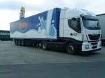 SZM IVECO Stralis mit Khlkofferauflieger der Milch Union Hocheifel eG gesehen auf dem Autohof in Grnstadt am 19.02.2014