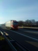 SZM MAN TGX 18.440 mit Pritsche-Planen-Auflieger gesehen auf der A 61, Hhe Raststtte Dannstadt am 15.01.2014