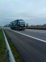 LKW MAN TGX Hngerzug mit Pritsche-Planen-Aufbau der Spedition Masonski gesehen auf der A 61, Hhe Raststtte Dannstadt, am 16.01.2014