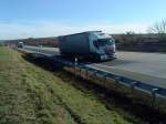 SZM IVECO Stralis mit Pritsche-Planen-Auflieger der Spedition ANTARES gesehen auf der A 6 - Hhe Autohof Grnstadt - am 28.01.2014