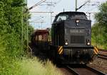 Locon 217/203 123-5(ex DR 202 376)mit Schotterwagenzug bei der Durchfahrt in Schleswig.