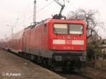 112 165-6 schiebt den RE1 Magdeburg aus den Bahnhof Eisenhttenstatd.